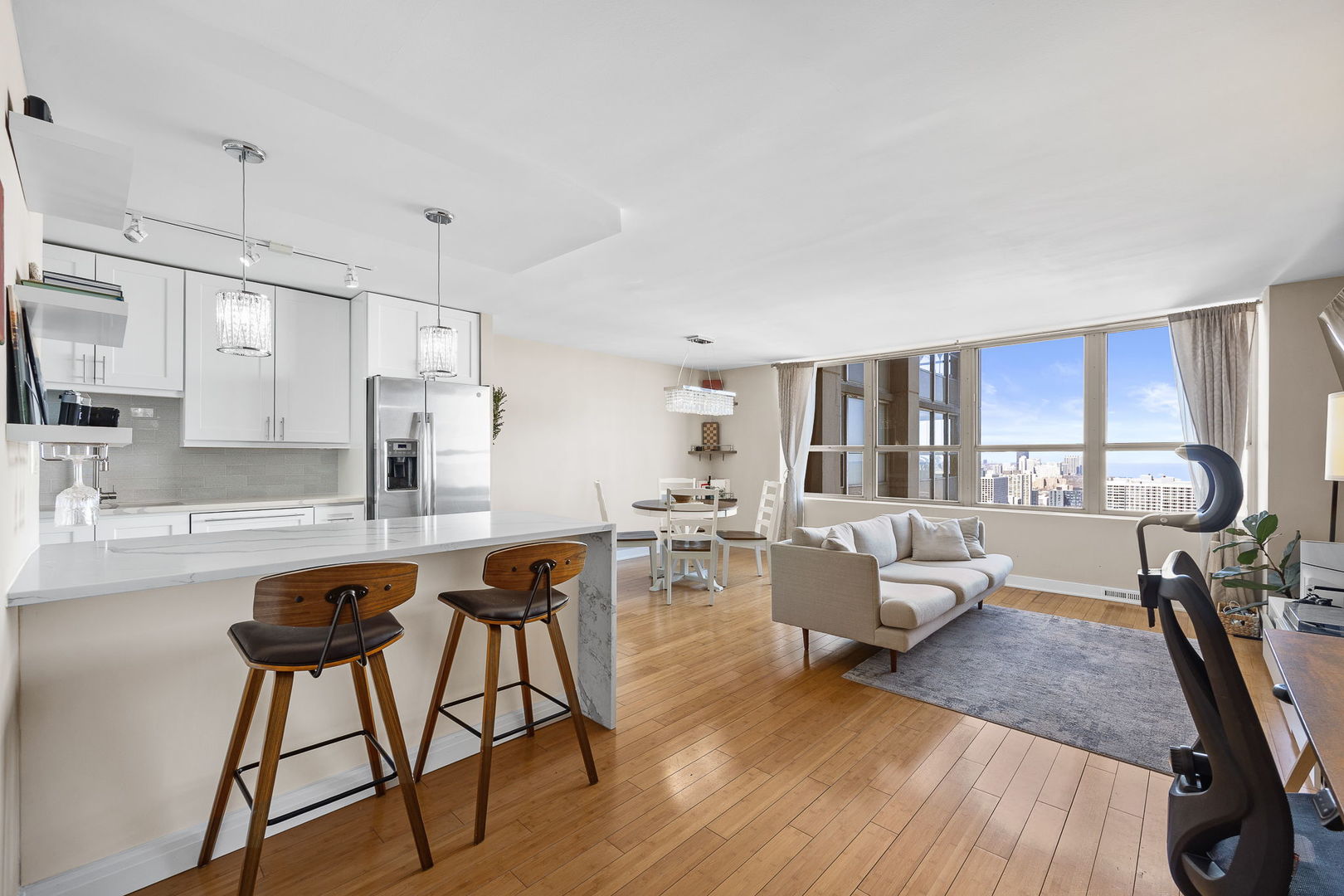 655 West Irving Park Road, Unit 3708 Chicago, IL 60613 - Photo 8 of 55 a living room with furniture and a wooden floor