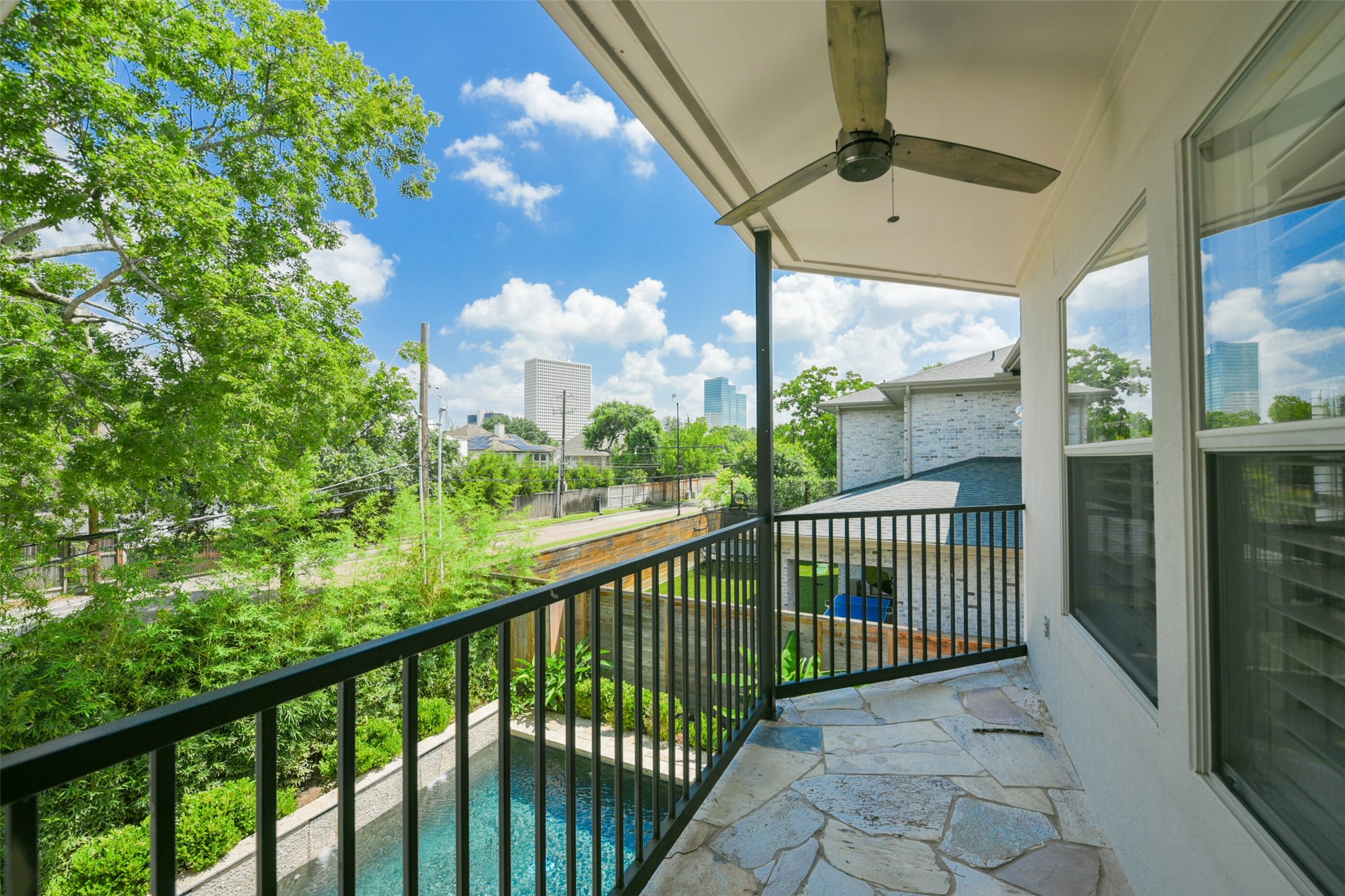 3724 Wroxton Road Houston, TX 77005 - Photo 29 of 40 Balcony off the primary bedroom overlooks the beautiful pool.