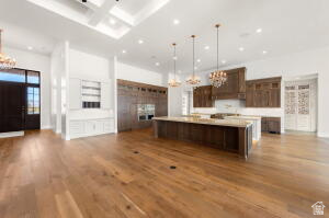 1141 East Lost Ridge Drive Washington, UT 84780 - Photo 33 of 108 Spacious open-concept kitchen and living area featuring wood-finish flooring, a coffered ceiling, and recessed lighting