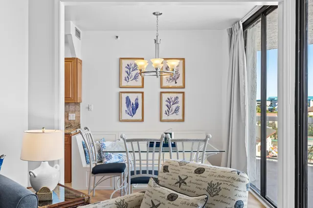 a kitchen with stainless steel appliances wooden floor and center island