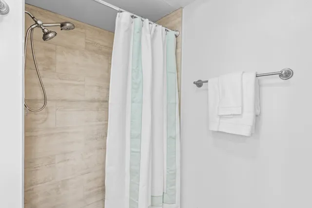 a bathroom with a toilet a sink and a mirror