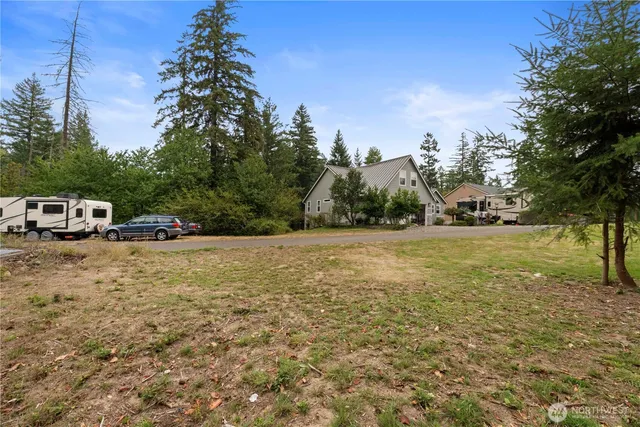 a view of outdoor space with deck and yard