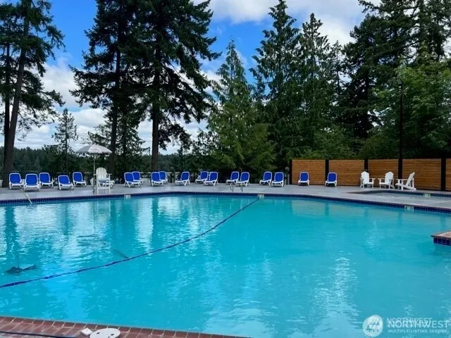 swimming view of a lake with a house