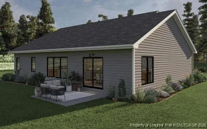 a front view of house with a garden