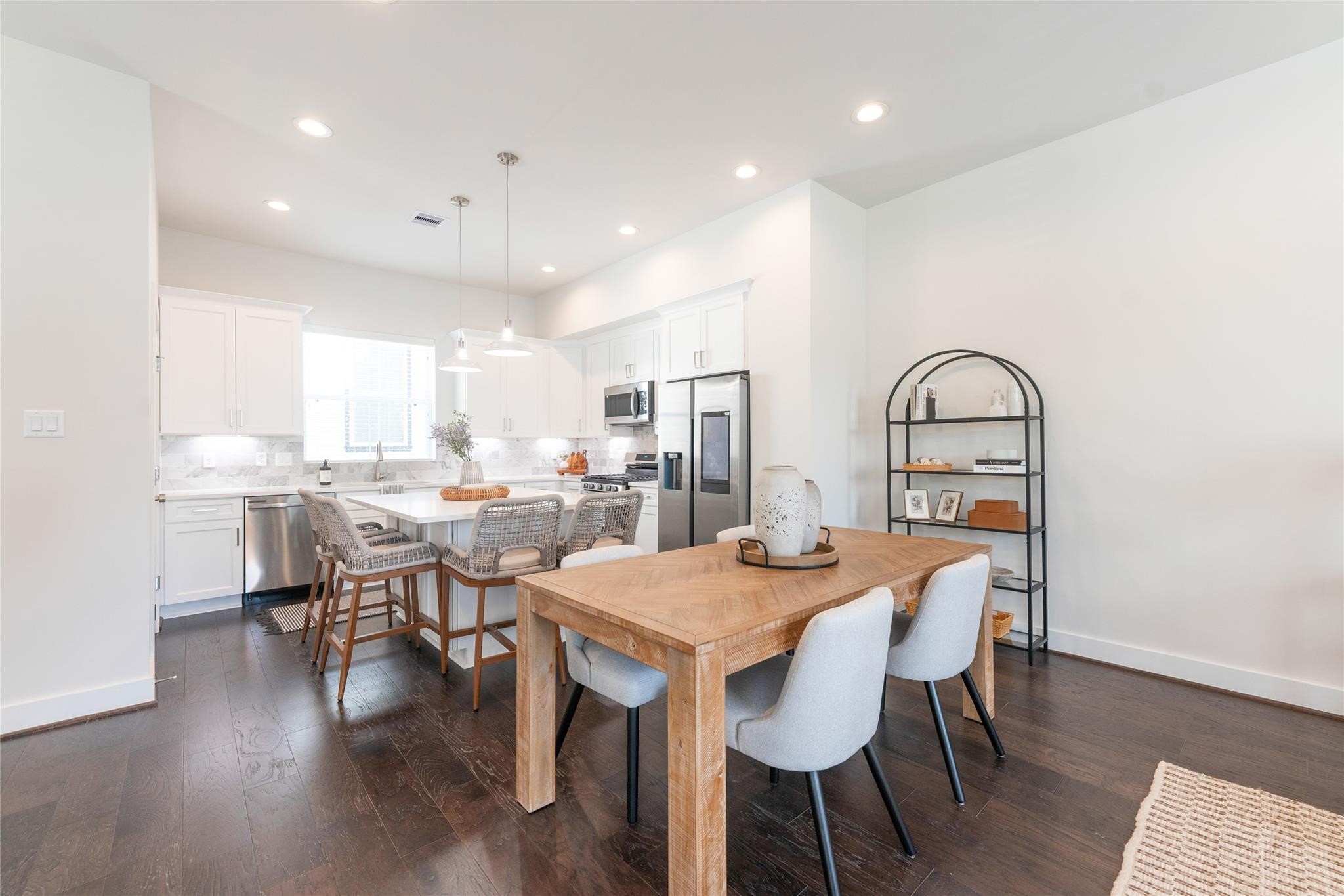5506 Wheatley Street, Unit F Houston, TX 77091 - Photo 5 of 15 a view of a dining room with furniture and wooden floor