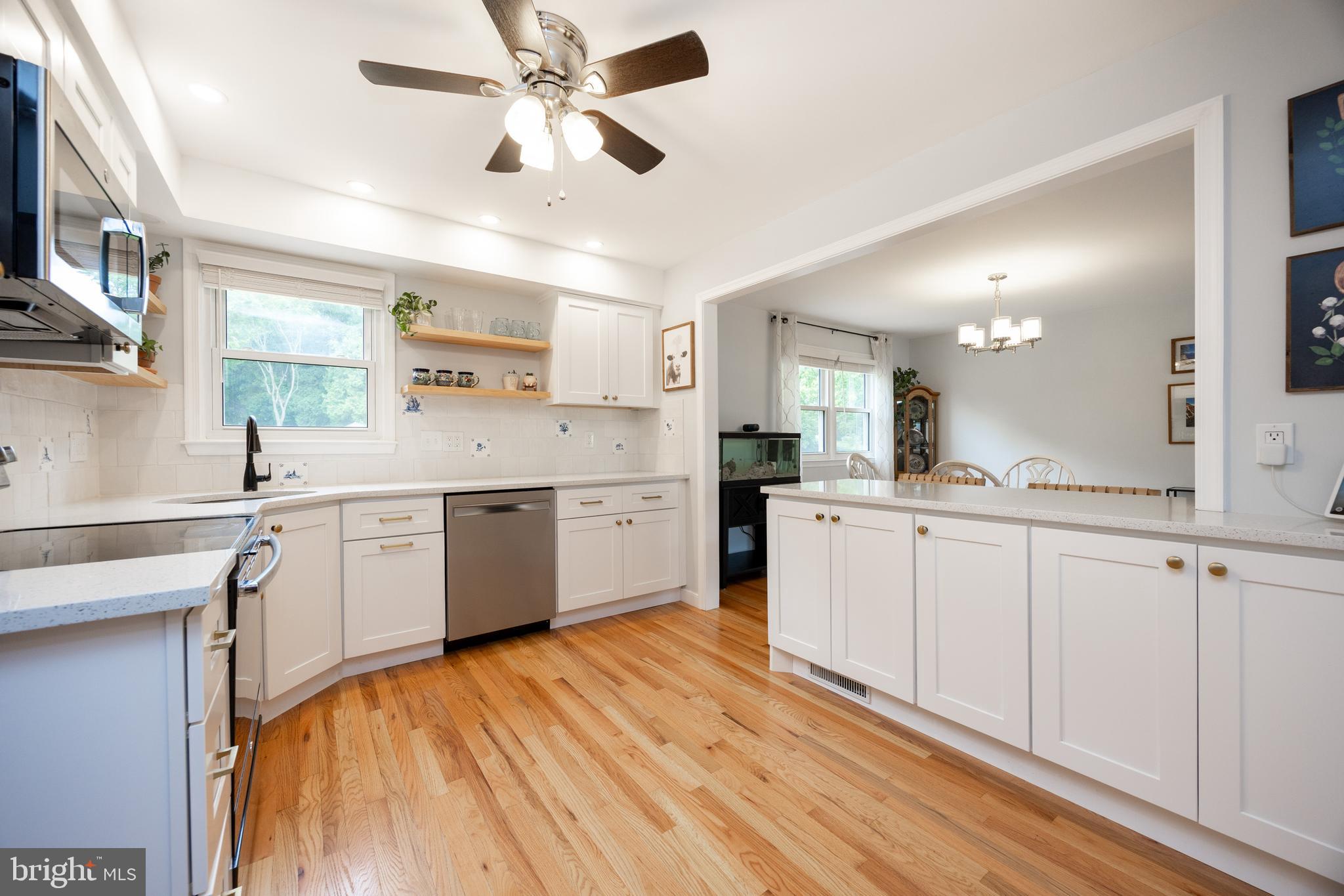 4445 Bethel Road Upper Chichester, PA 19061 - Photo 15 of 41 a kitchen with a white cabinets stainless steel appliances and a window