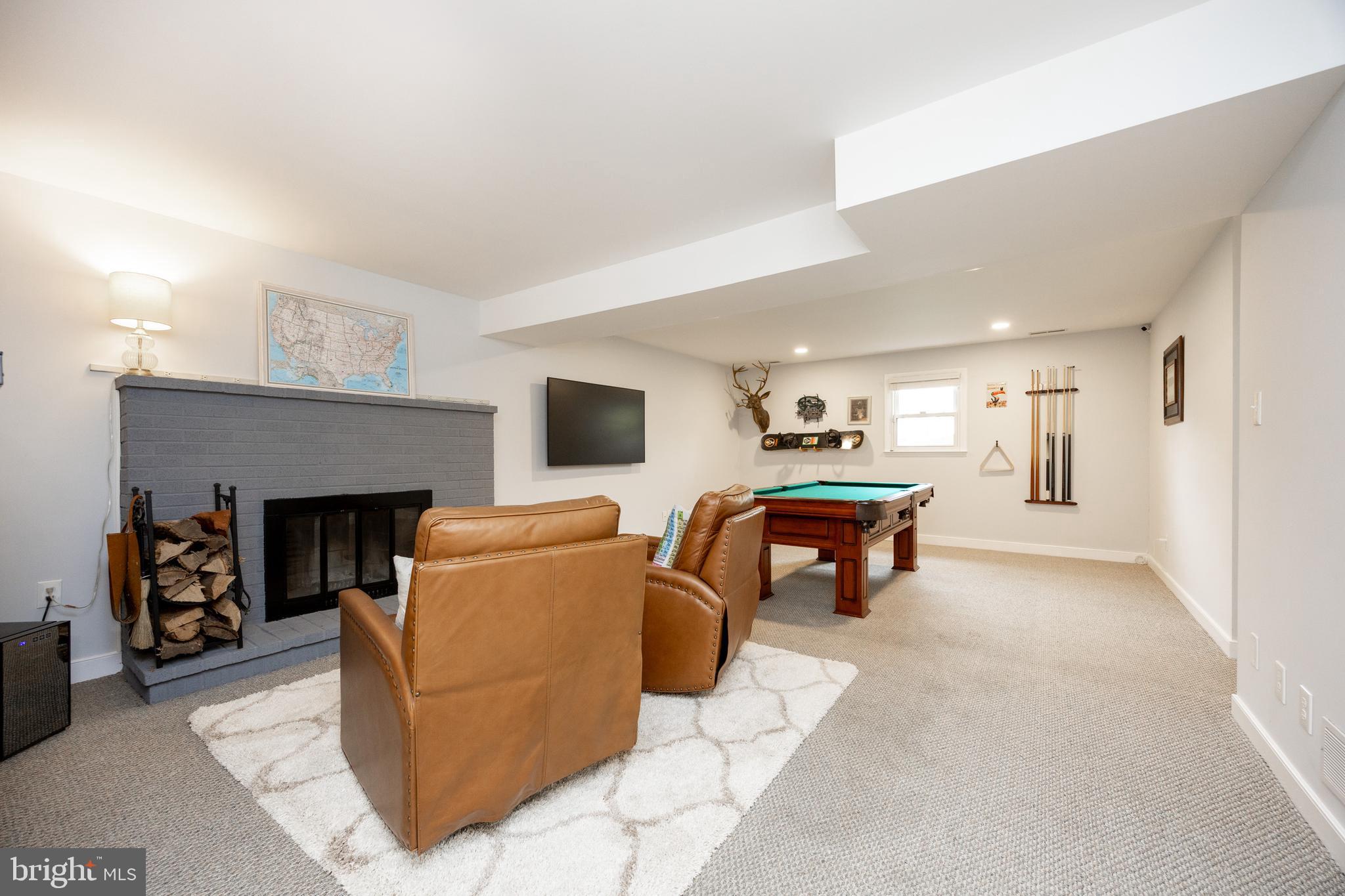 4445 Bethel Road Upper Chichester, PA 19061 - Photo 27 of 41 a living room with furniture and a fireplace