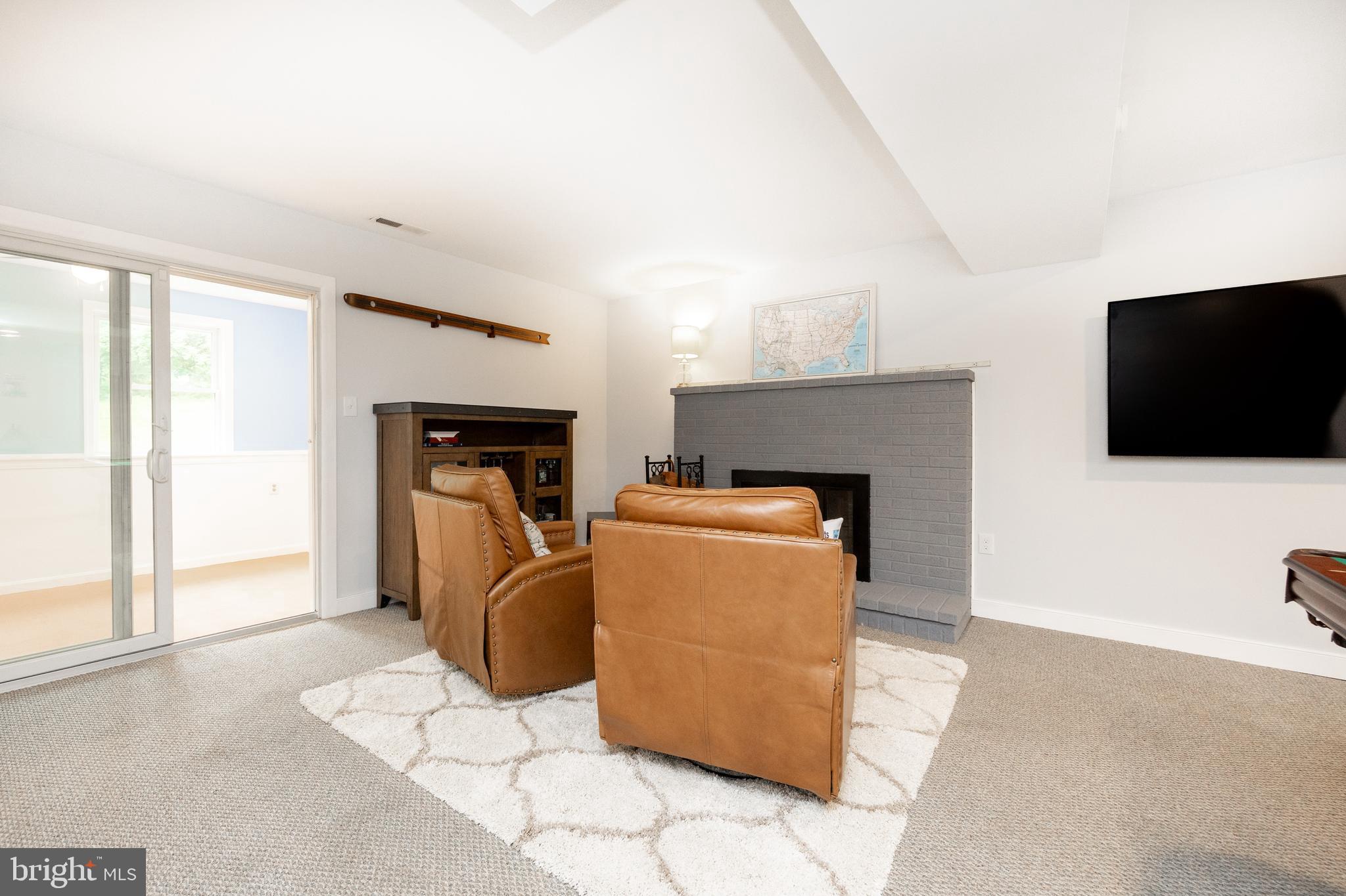 4445 Bethel Road Upper Chichester, PA 19061 - Photo 28 of 41 a living room with furniture and a flat screen tv