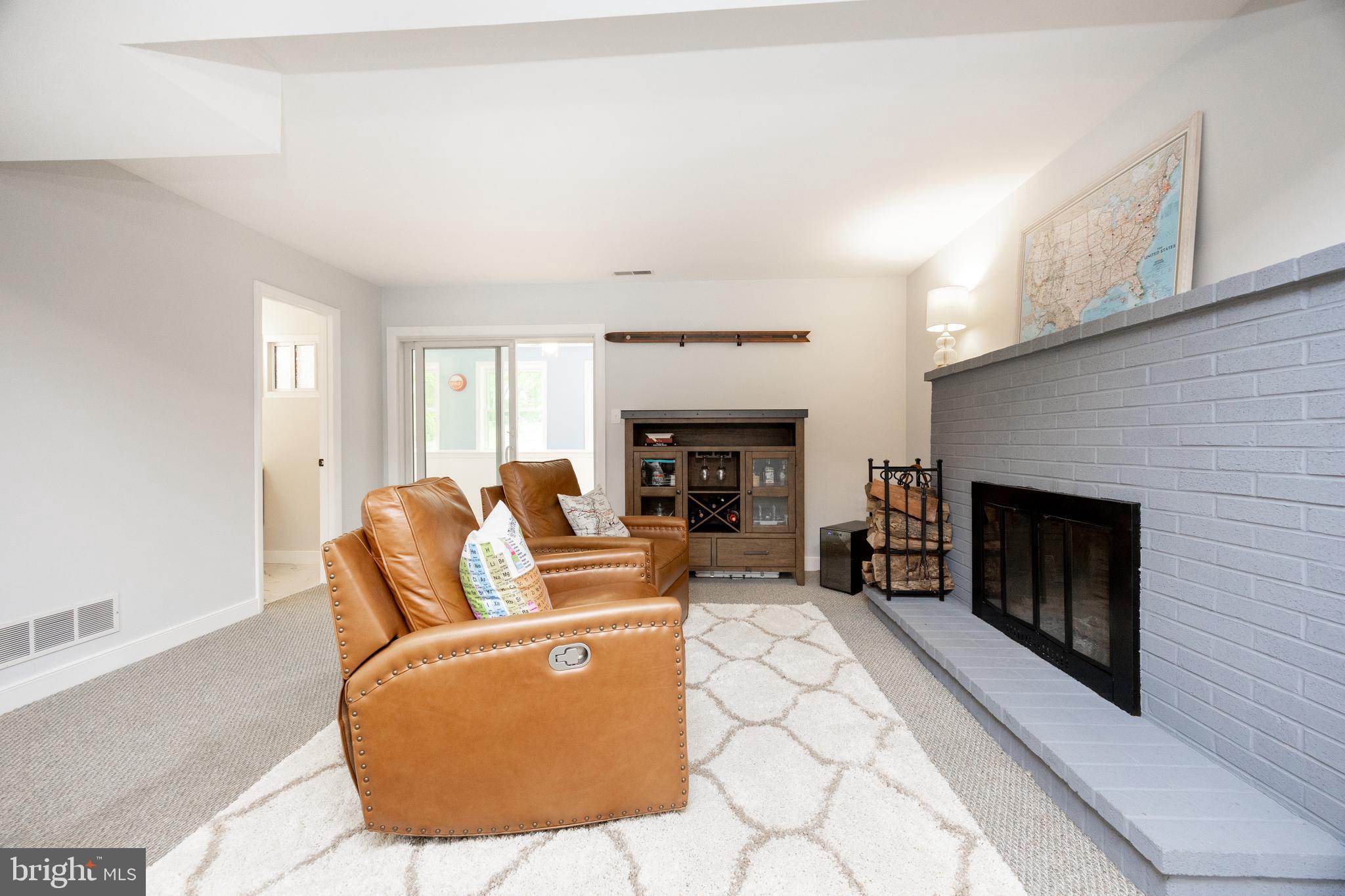 4445 Bethel Road Upper Chichester, PA 19061 - Photo 29 of 41 a living room with furniture and a fireplace