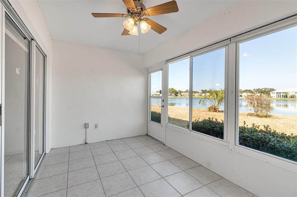 4115 Putter Place, Unit 4115 Bradenton, FL 34203 - Photo 19 of 65 a view of an empty room and window ceiling fan