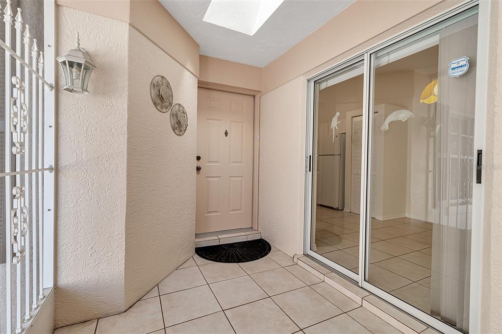 4115 Putter Place, Unit 4115 Bradenton, FL 34203 - Photo 2 of 65 a bathroom with a glass shower door
