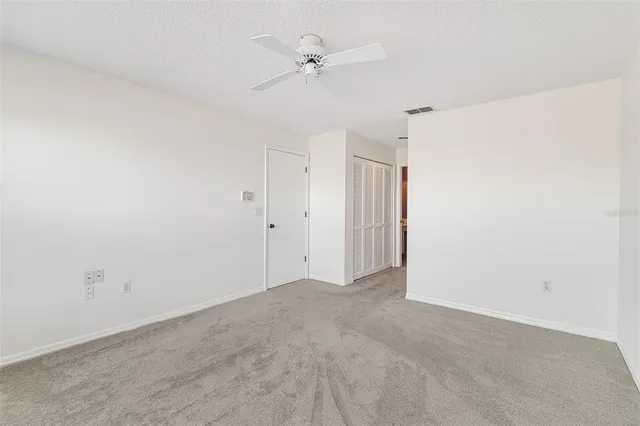 a bathroom with a shower a toilet and a sink