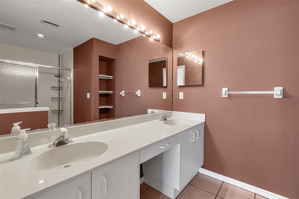 4115 Putter Place, Unit 4115 Bradenton, FL 34203 - Photo 25 of 65 a bathroom with a sink and a mirror