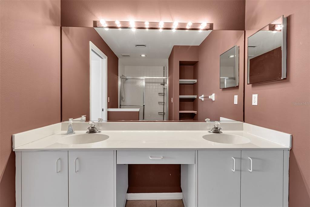 4115 Putter Place, Unit 4115 Bradenton, FL 34203 - Photo 26 of 65 a bathroom with a sink and a mirror