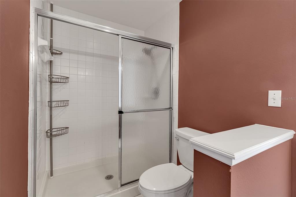 4115 Putter Place, Unit 4115 Bradenton, FL 34203 - Photo 27 of 65 a bathroom with a shower a toilet and a sink