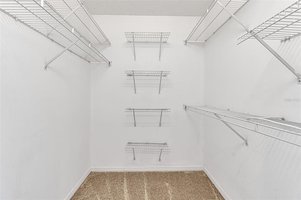 4115 Putter Place, Unit 4115 Bradenton, FL 34203 - Photo 28 of 65 a view of walk in closet with empty racks