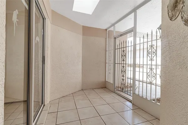 a view of an empty room and a window