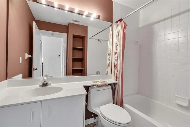 an aerial view of a house with a lake view