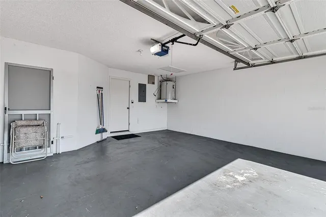 a living room with fireplace furniture and a large window