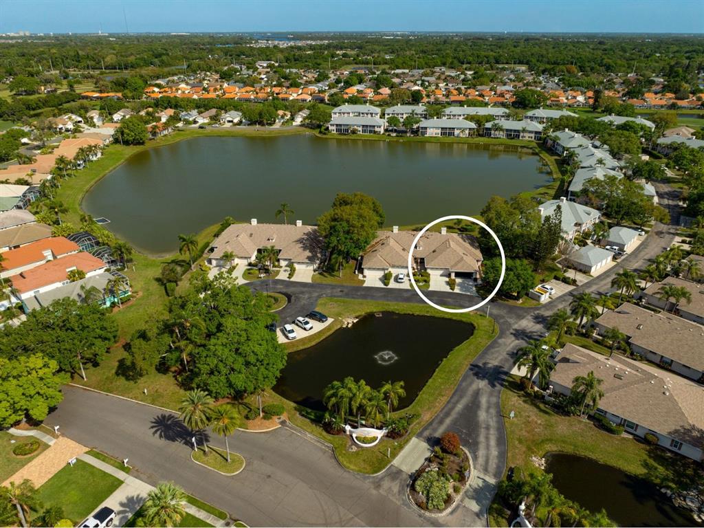 4115 Putter Place, Unit 4115 Bradenton, FL 34203 - Photo 38 of 65 an aerial view of a house with a lake view