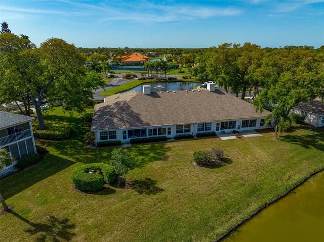a view of a chairs and table in backyard