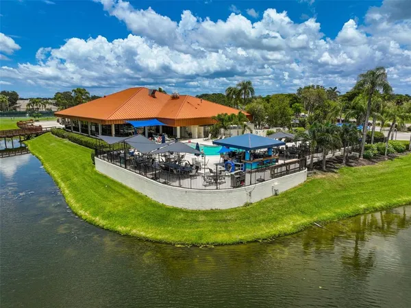 a view of a golf course with a lake view