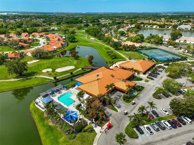 an aerial view of a pool yard swimming pool and outdoor seating