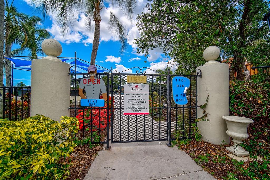 4115 Putter Place, Unit 4115 Bradenton, FL 34203 - Photo 51 of 65 a front view of a house with a garden