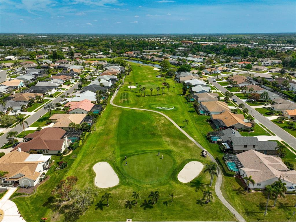 4115 Putter Place, Unit 4115 Bradenton, FL 34203 - Photo 60 of 65 an aerial view of residential houses with outdoor space and trees
