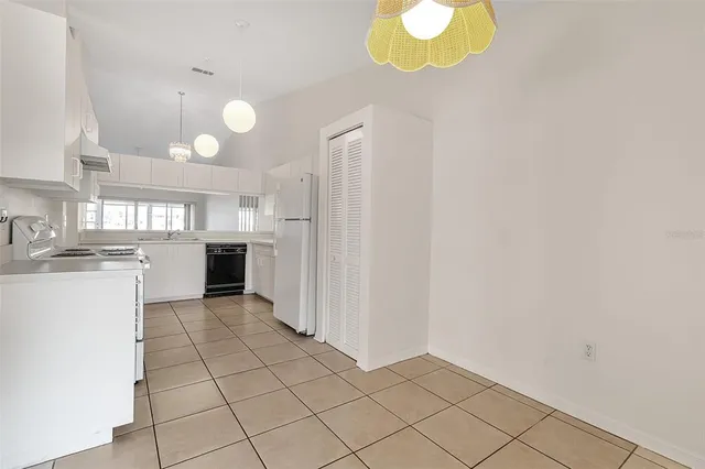 a view of a kitchen with a sink