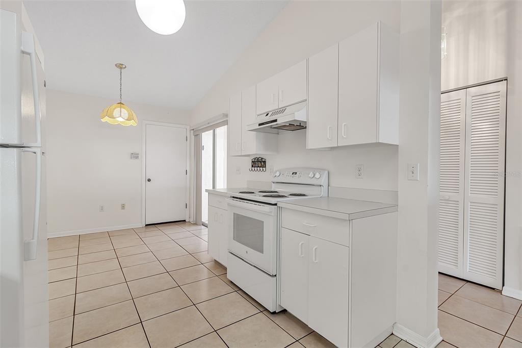 4115 Putter Place, Unit 4115 Bradenton, FL 34203 - Photo 10 of 65 a kitchen with cabinets and appliances