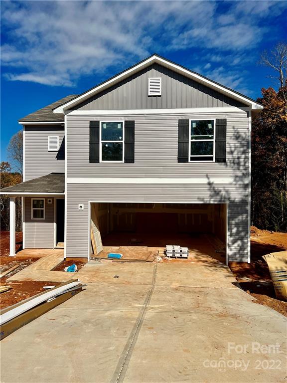 a front view of a house with yard