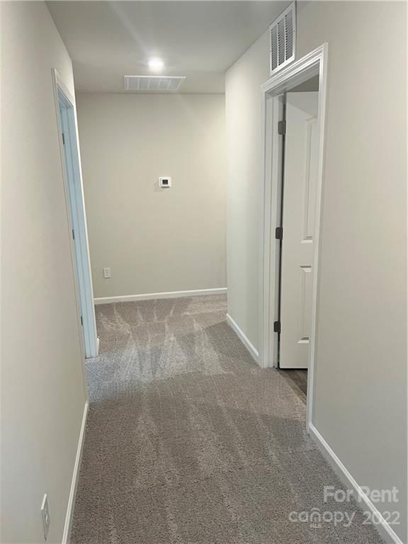 4852 Stone Drive, Unit 127 Conover, NC 28613 - Photo 13 of 34 an empty room with windows