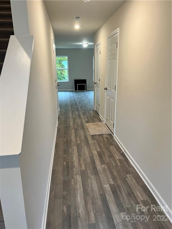 4852 Stone Drive, Unit 127 Conover, NC 28613 - Photo 2 of 34 a view of a hallway with wooden floor
