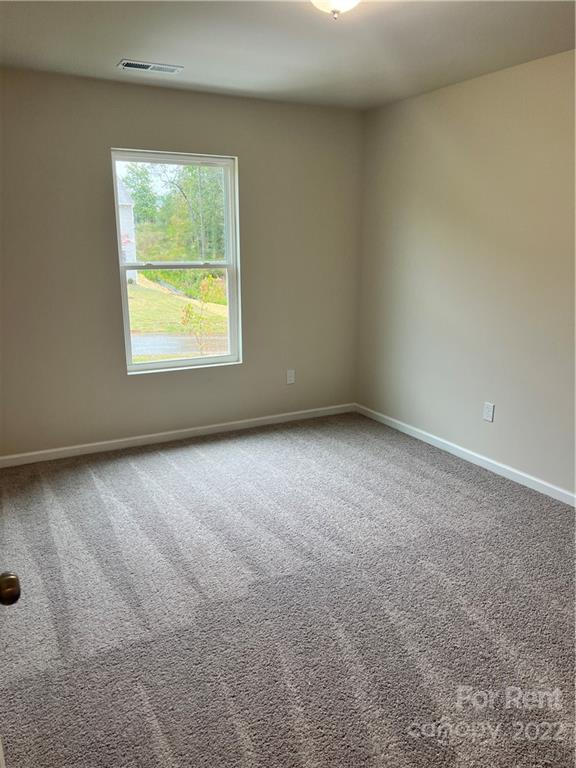 4852 Stone Drive, Unit 127 Conover, NC 28613 - Photo 23 of 34 an empty room with a window