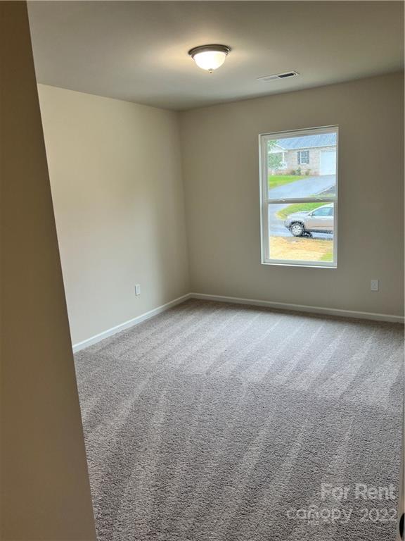 4852 Stone Drive, Unit 127 Conover, NC 28613 - Photo 25 of 34 an empty room with windows