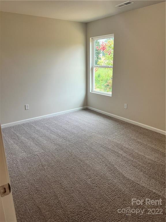 4852 Stone Drive, Unit 127 Conover, NC 28613 - Photo 27 of 34 an empty room with windows
