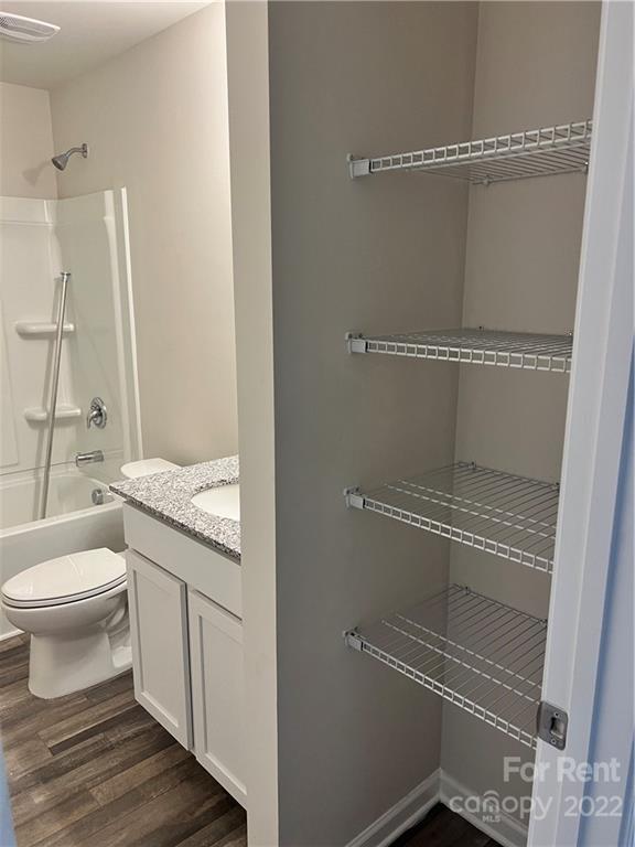 4852 Stone Drive, Unit 127 Conover, NC 28613 - Photo 28 of 34 a bathroom with a granite countertop sink mirror vanity and toilet