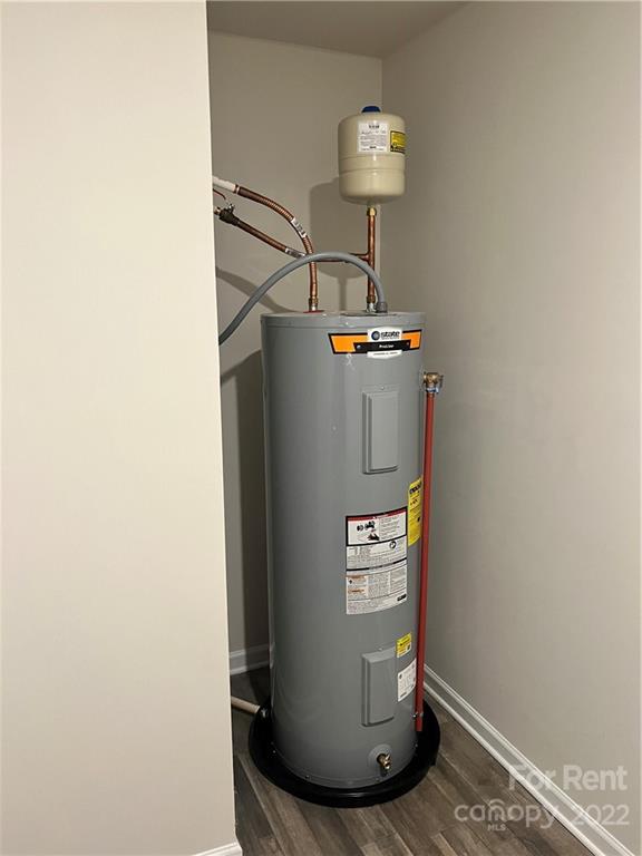 4852 Stone Drive, Unit 127 Conover, NC 28613 - Photo 33 of 34 a view of a hallway with wooden floor and dining room