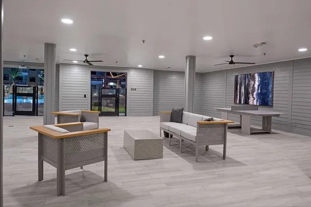 a living room with furniture and a table