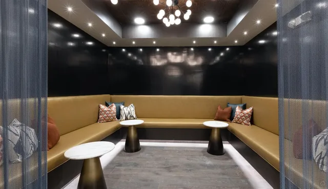 a bathroom with a bathtub and a couch