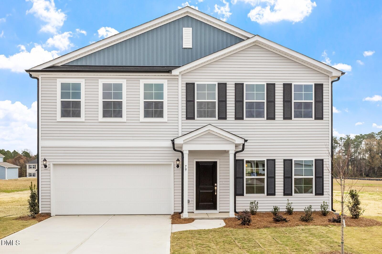 79 Osgood Street Angier, NC 27501 - Photo 4 of 31 a front view of a house with a yard
