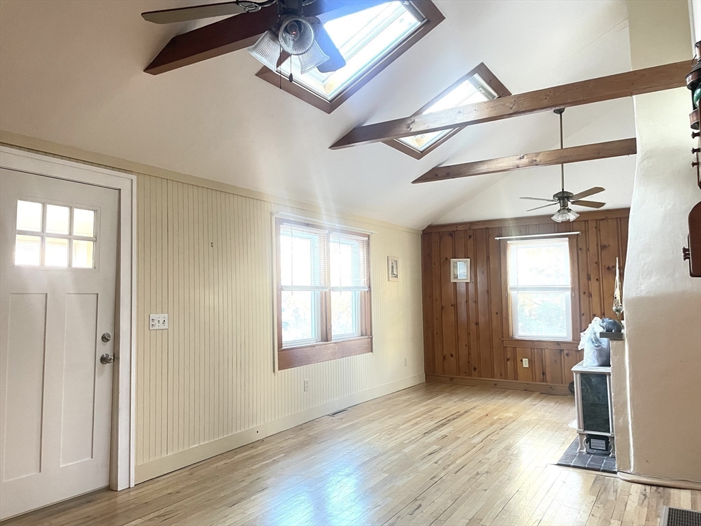 20 Postscript Lane Scituate, MA 02050 - Photo 12 of 19 a view of empty room with wooden floor and fan