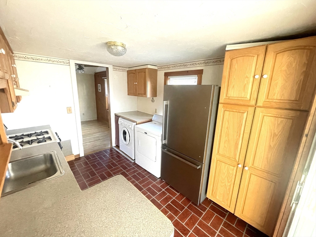 20 Postscript Lane Scituate, MA 02050 - Photo 13 of 19 a kitchen with stainless steel appliances granite countertop a refrigerator and a stove