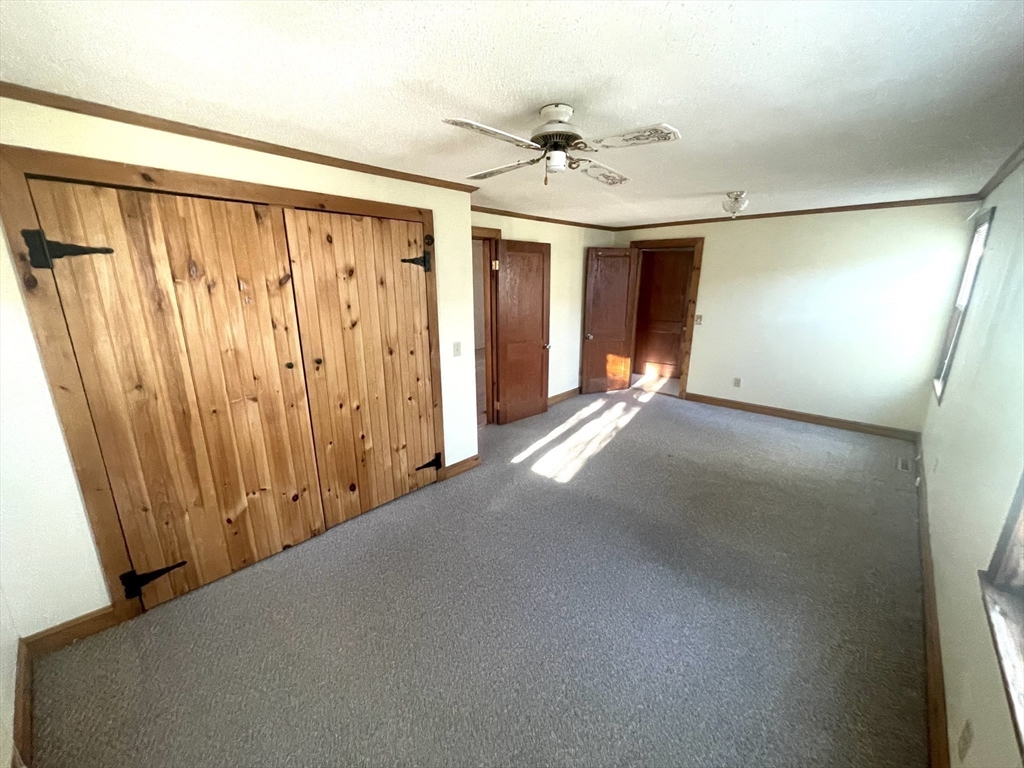 20 Postscript Lane Scituate, MA 02050 - Photo 17 of 19 a view of a livingroom with an empty space and a ceiling fan