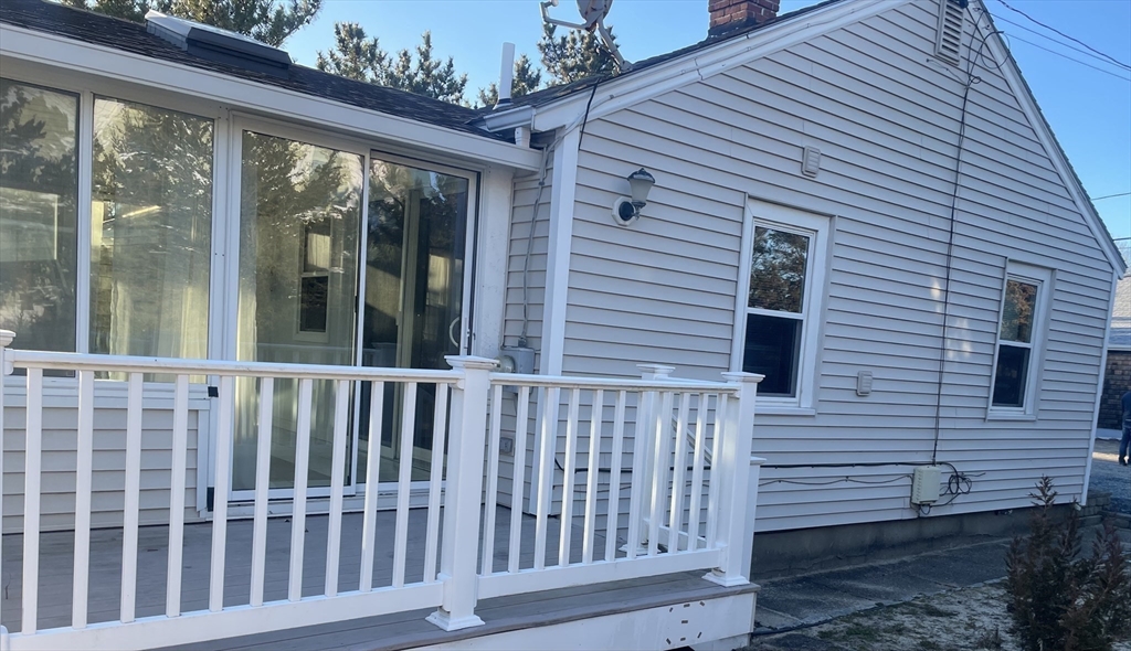 20 Postscript Lane Scituate, MA 02050 - Photo 19 of 19 a view of a wooden bench in front of a house