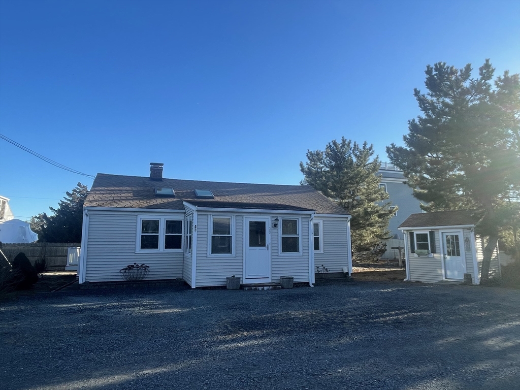 20 Postscript Lane Scituate, MA 02050 - Photo 6 of 19 a front view of a house with a garden
