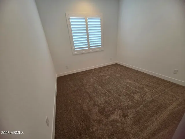 a bathroom with sink shower and mirror