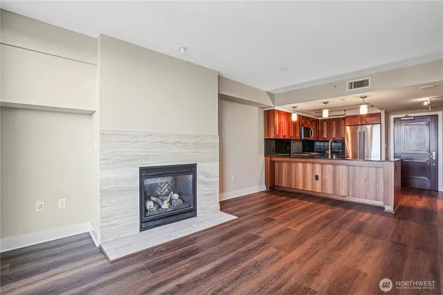 a view of a living room a fireplace and entryway