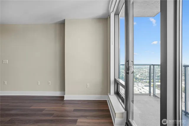 a view of an entryway with wooden floor